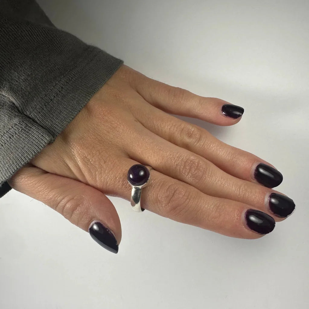 Sleek silver amethyst ring with smooth round purple gemstone