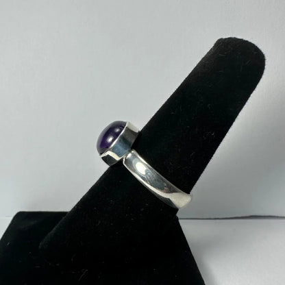 Sleek silver amethyst ring with smooth purple stone