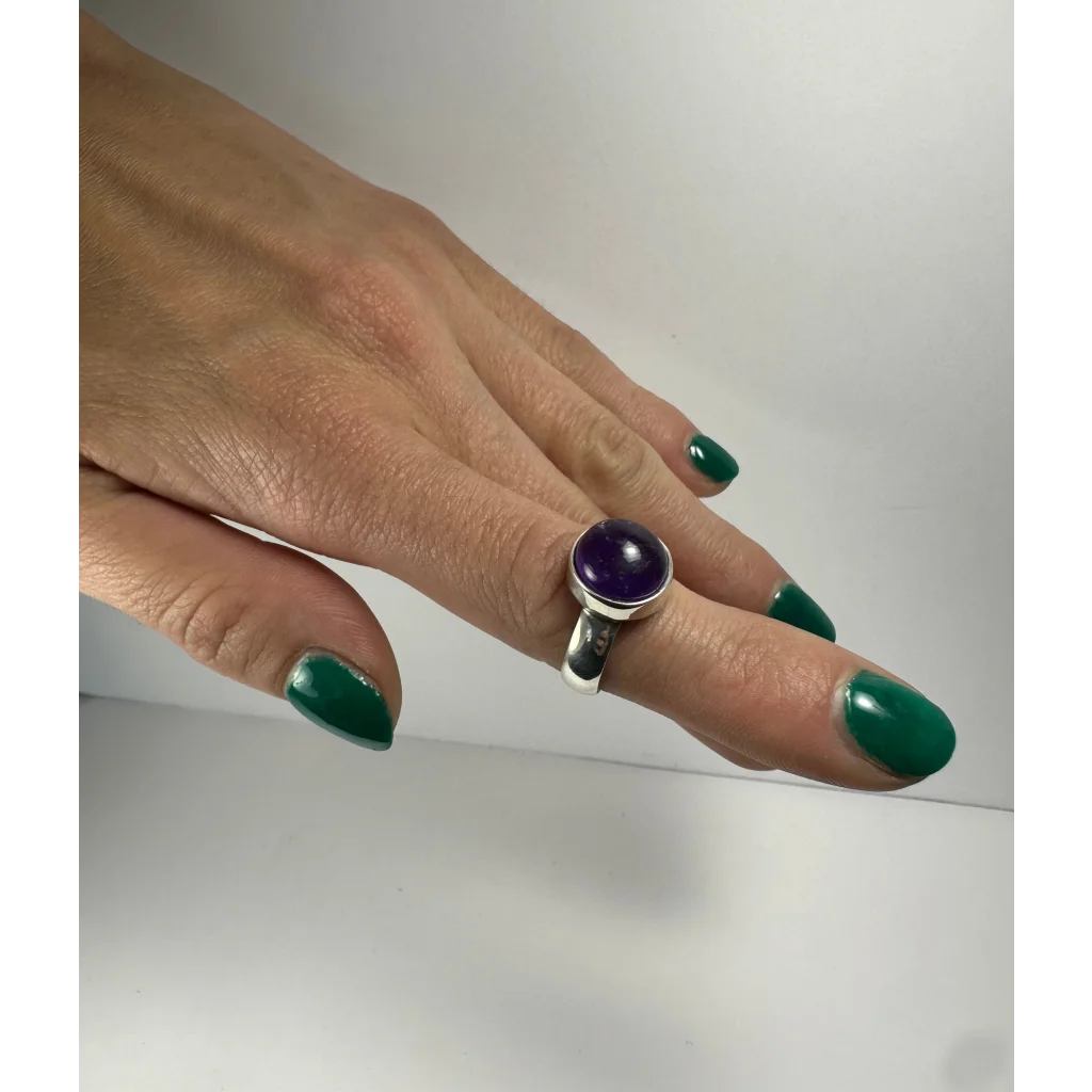 Stunning silver amethyst ring with deep purple gem in bezel