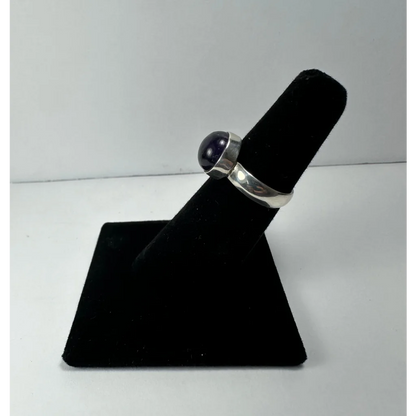 Sleek sterling silver amethyst ring with smooth purple cabochon stone
