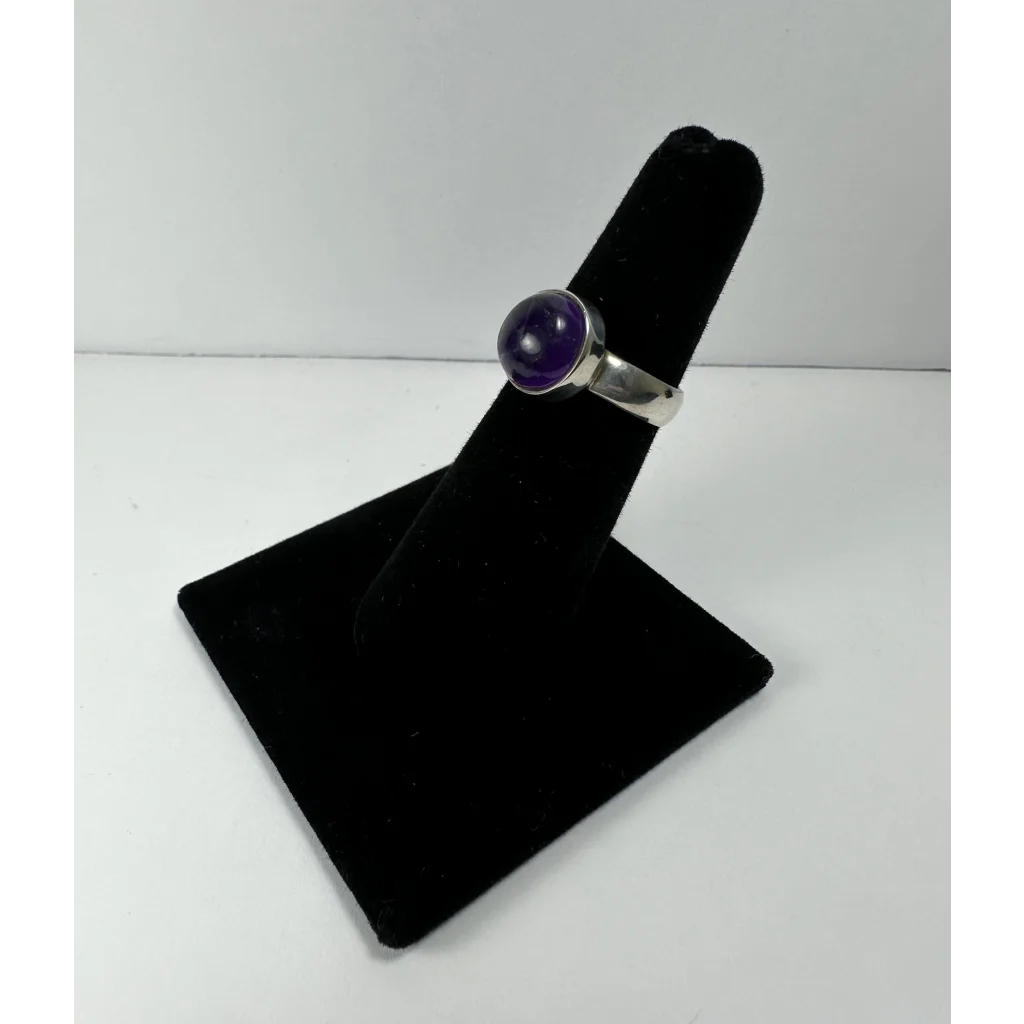 Sleek sterling silver amethyst ring with deep purple bezel-set stone