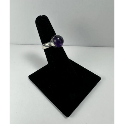 Sleek silver amethyst ring with smooth purple stone in polished band