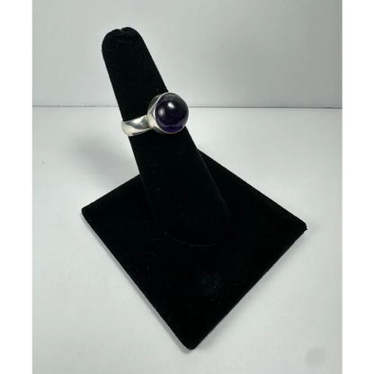 Sleek silver amethyst ring with smooth round stone in minimalist band