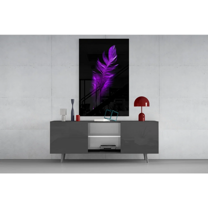 Vibrant purple feather glass wall art print on black frame above gray console