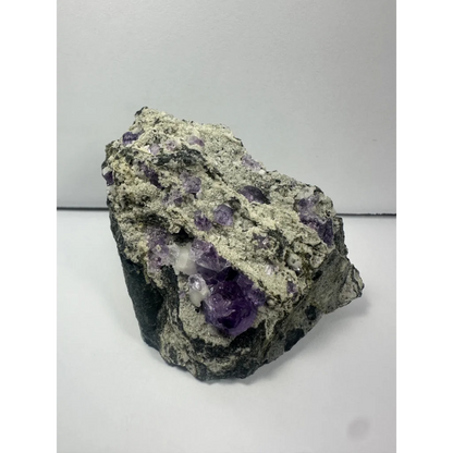 Rugged purple fluorite clusters on natural gray matrix from China