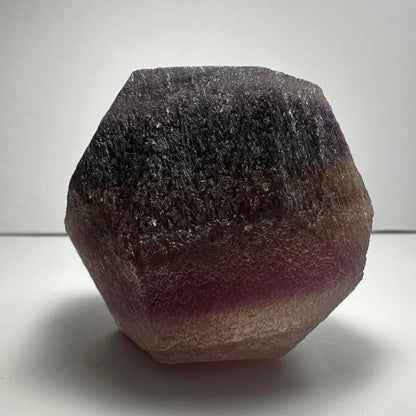 Stunning purple fluorite dodecahedron geode with purple-to-pink gradient