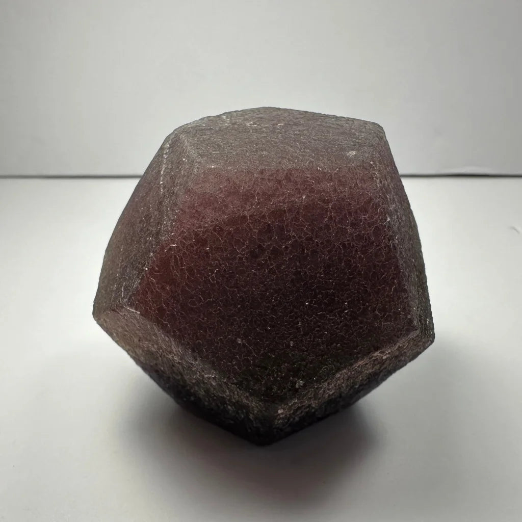 Stunning purple fluorite dodecahedron crystal geode with crackled texture