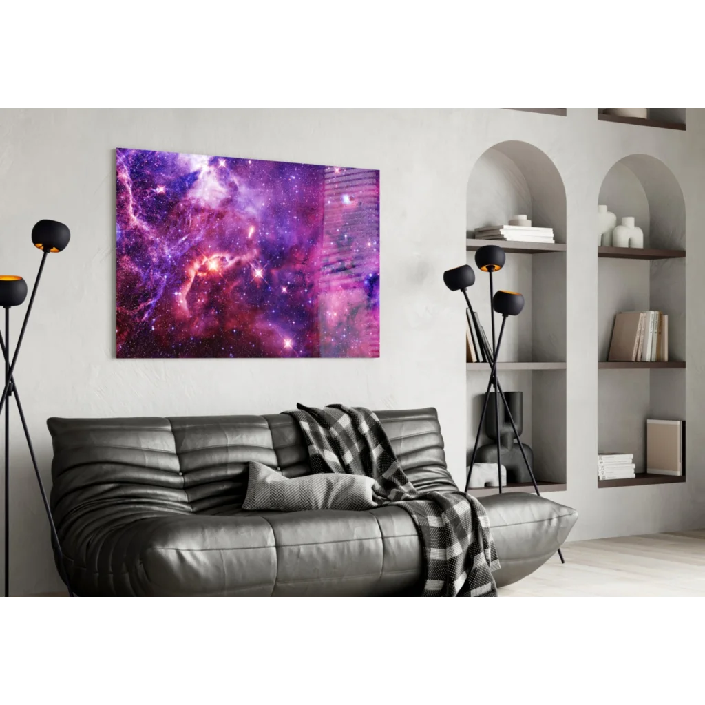 Purple and pink nebula wall art print on black leather couch
