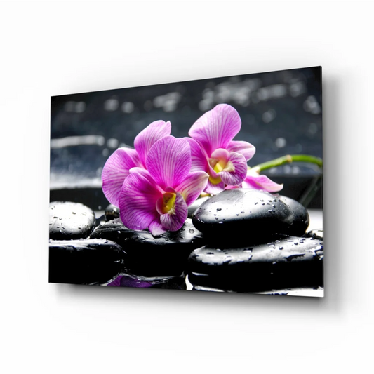 Stunning purple orchid glass wall art on black stones