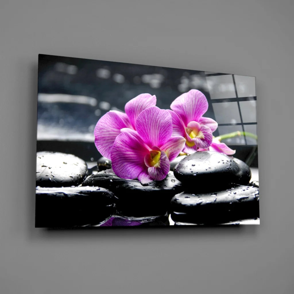 Stunning purple orchid glass wall art on black stones