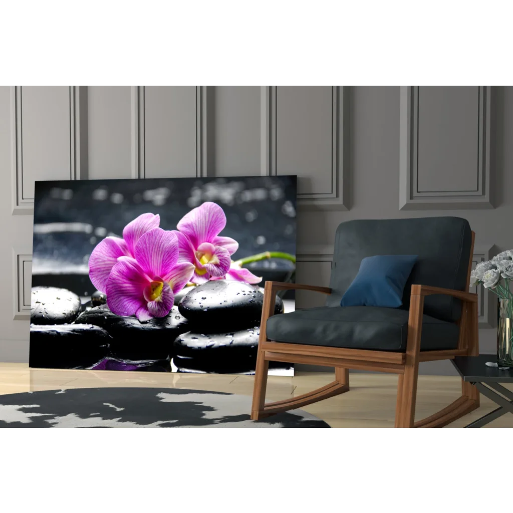 Stunning purple orchid glass wall art on black stones with water droplets