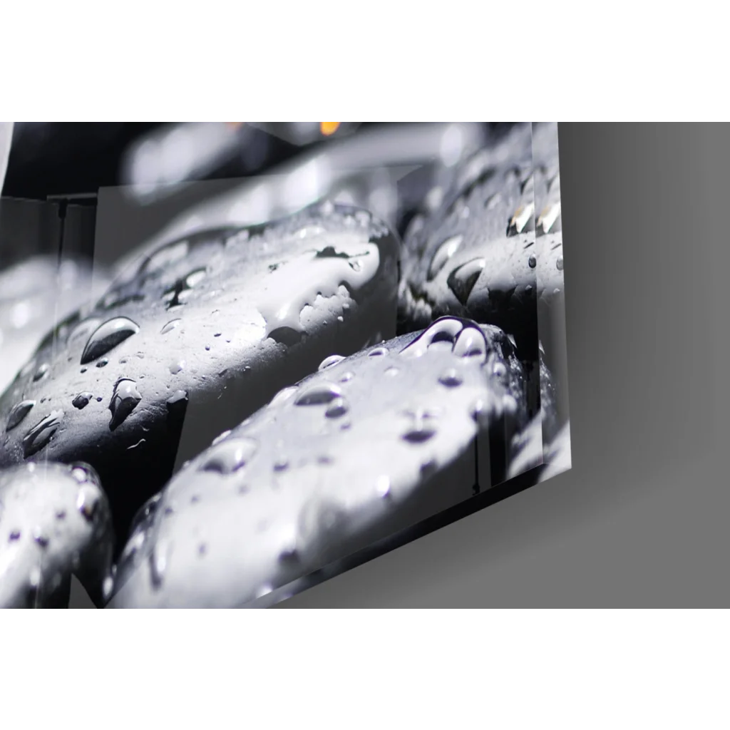 Black pebble wall art with water droplets in stunning purple orchid glass wall