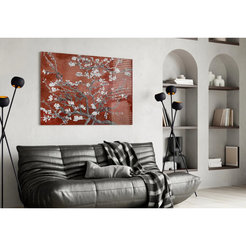 Black leather sofa with checkered throw and red almond blossom wall art