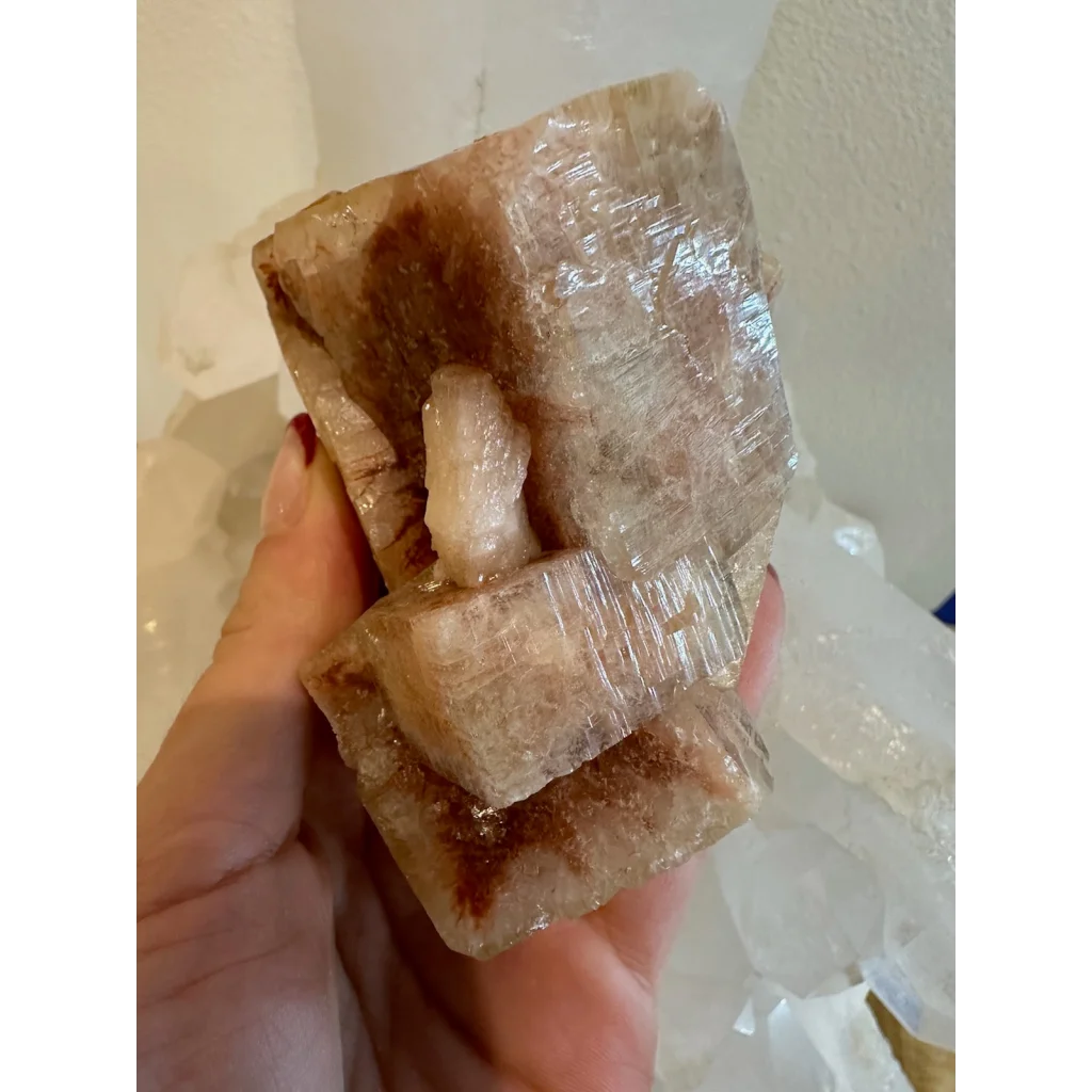 Hand holding stunning red apophyllite cube cluster from Pune, India