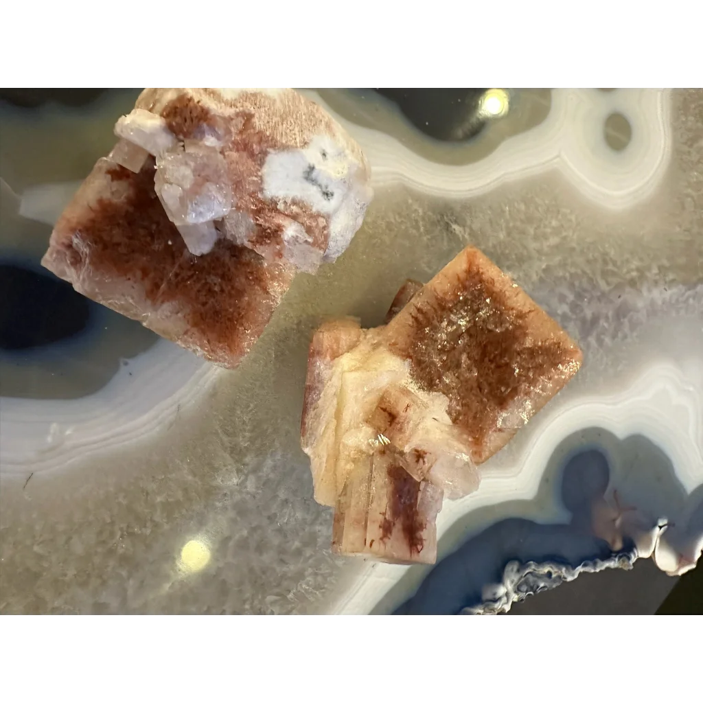 Stunning red apophyllite cube from India with purple streaks on agate