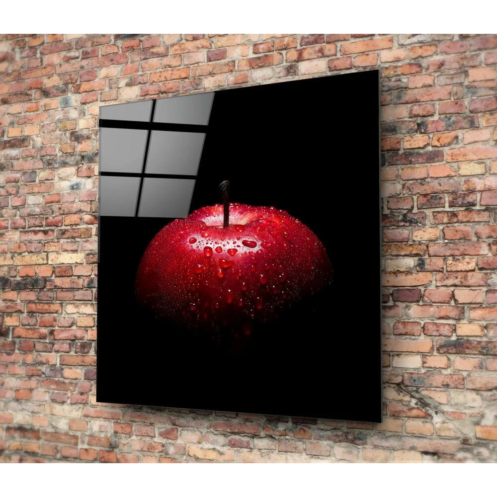 Stunning red apple glass wall art with water droplets on black background
