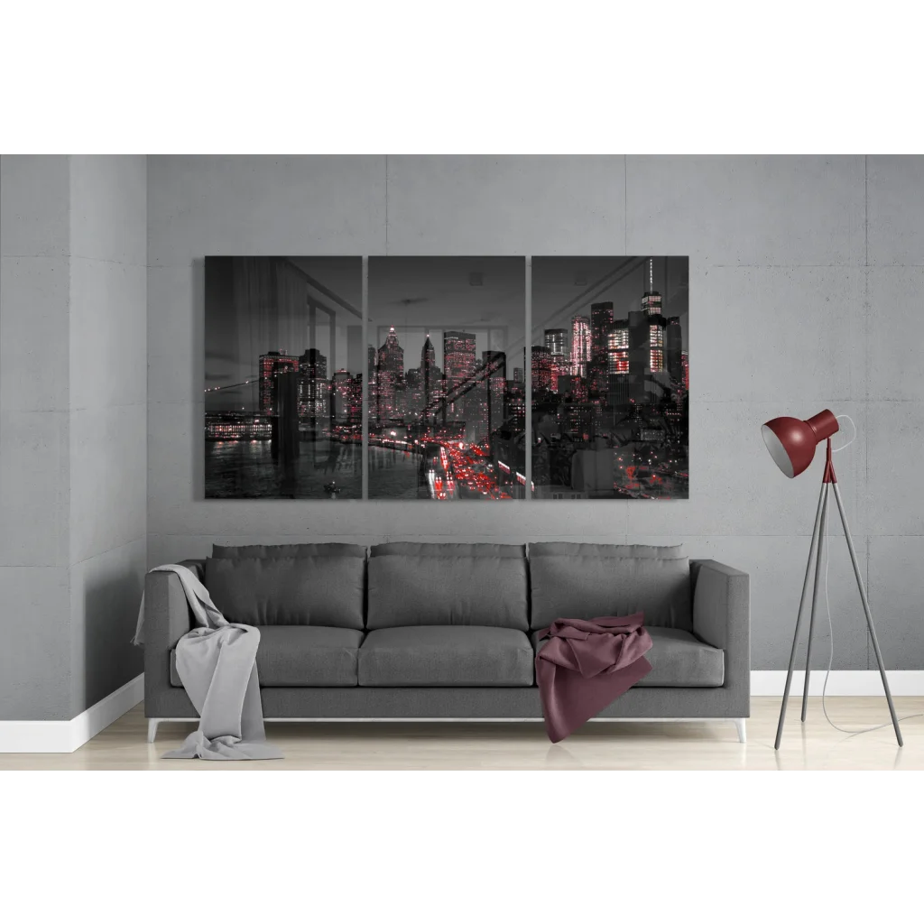 Grayscale cityscape triptych glass art with red accents on gray wall
