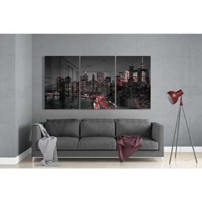 Grayscale cityscape triptych glass art with red accents on gray wall