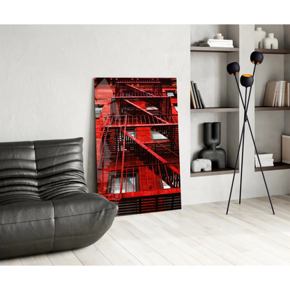 Vibrant red fire escape glass wall art print on white wall