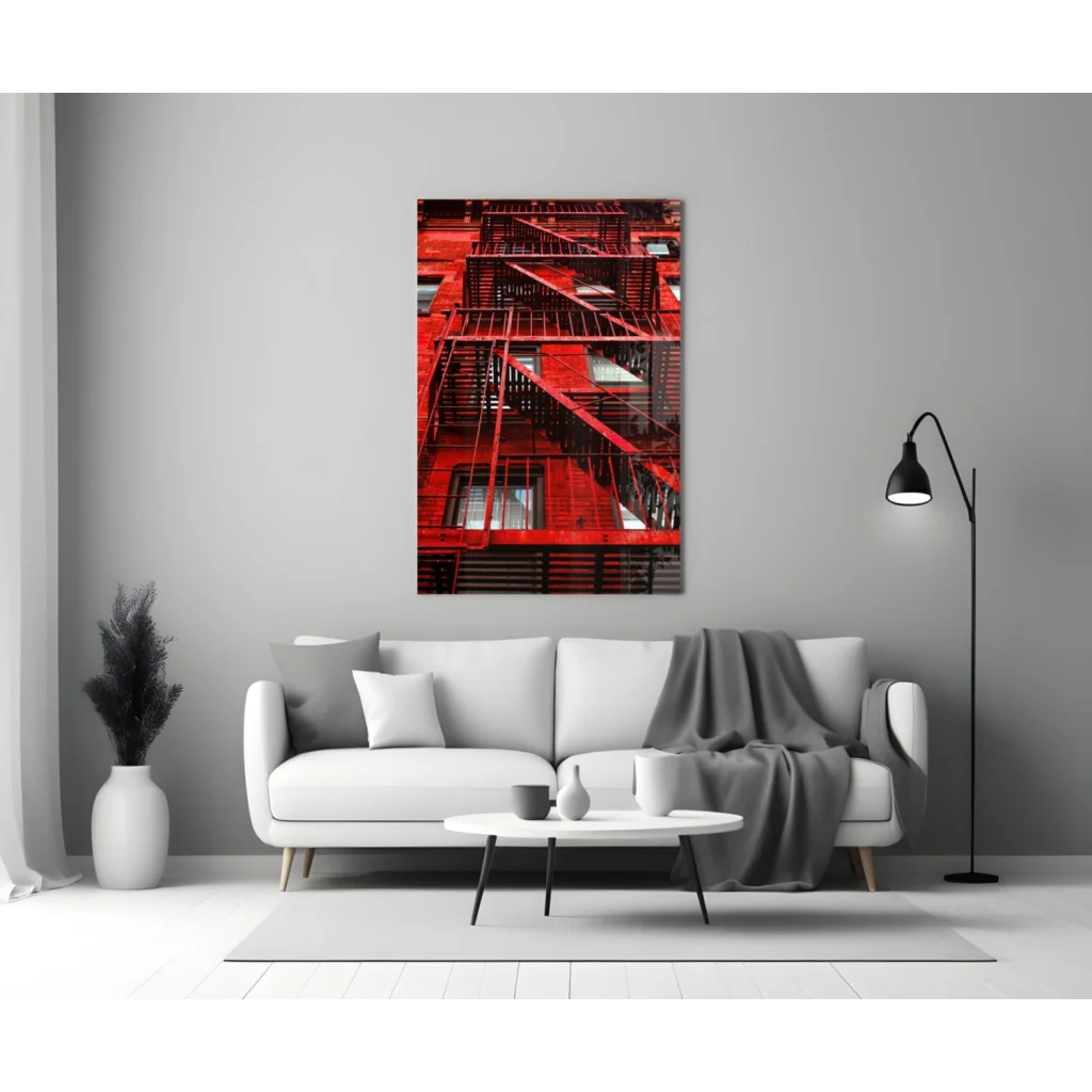 Vibrant red fire escape glass wall art print on gray wall