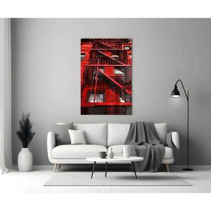 Vibrant red fire escape glass wall art print on gray wall
