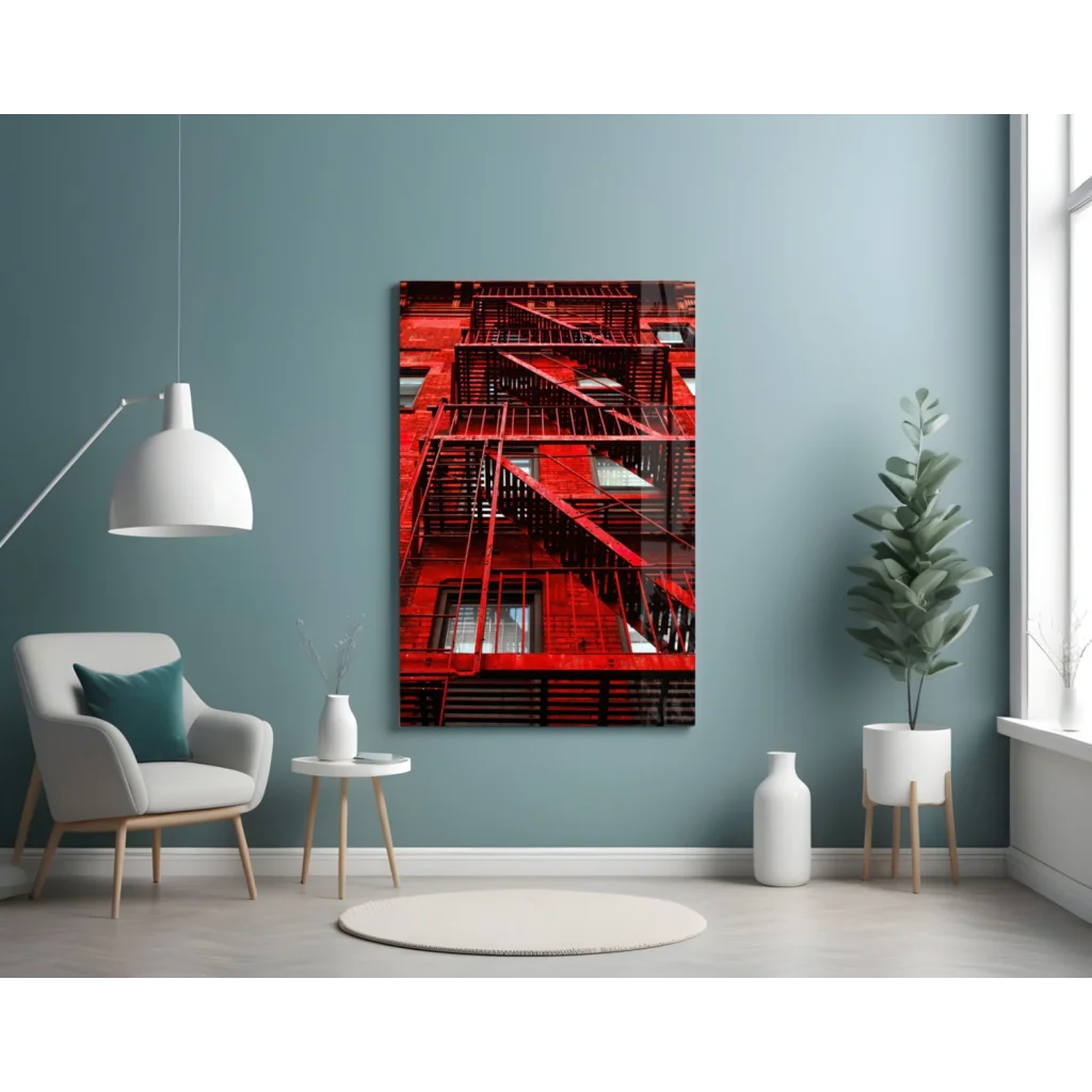 Vibrant red fire escape glass wall art on teal wall