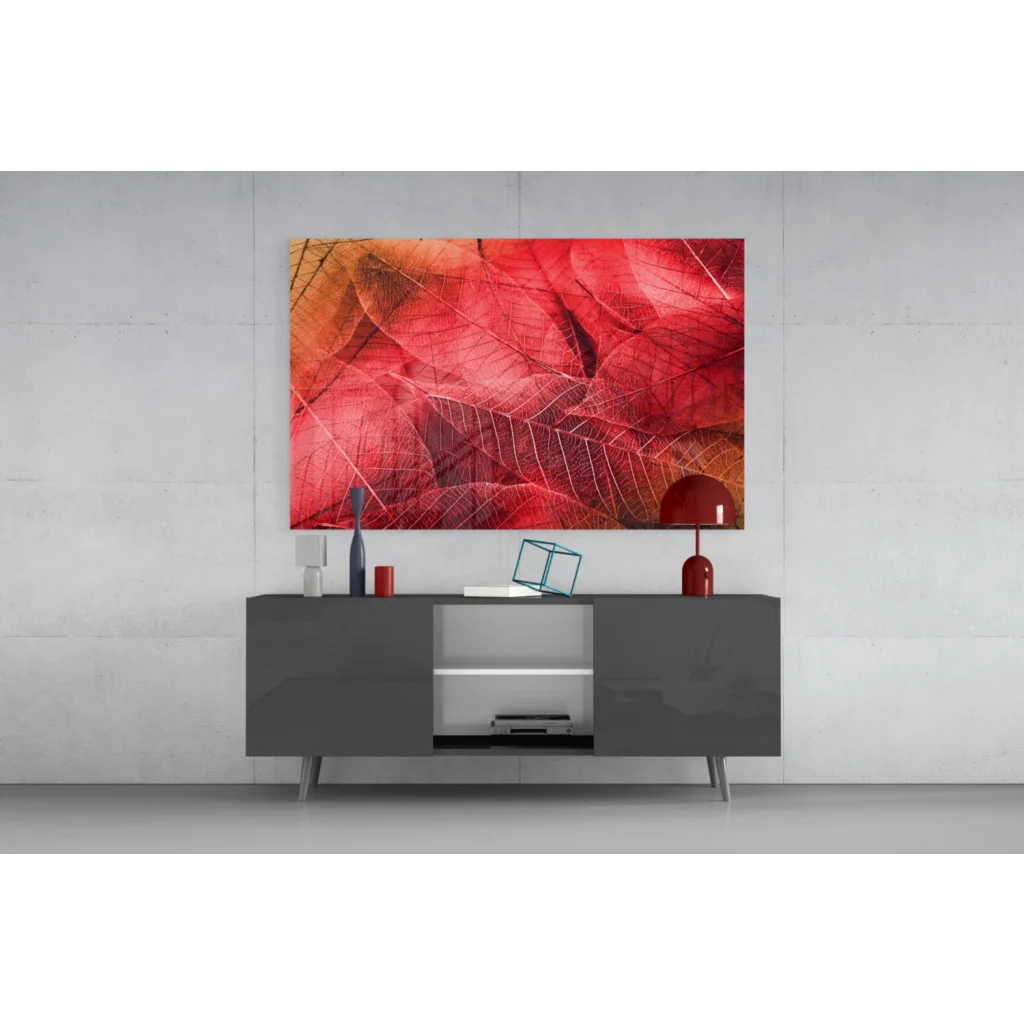 Modern gray sideboard with sleek silver legs under red leaf wall art