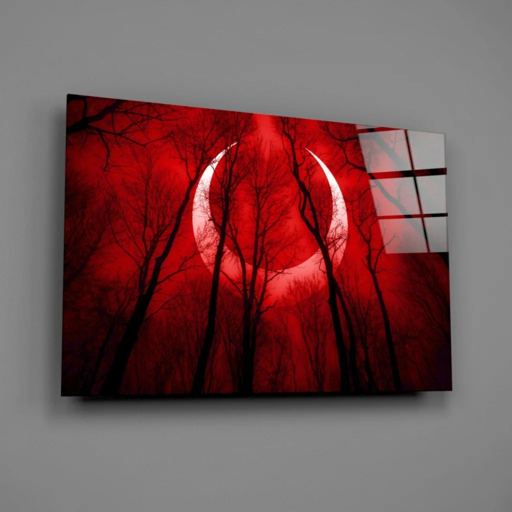 Stunning red crescent moon glass wall art with black tree silhouettes