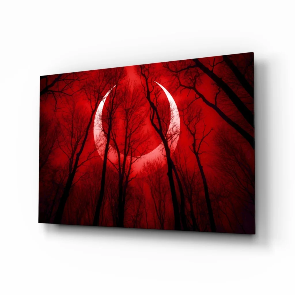 Stunning red crescent moon glass wall art with black tree silhouettes