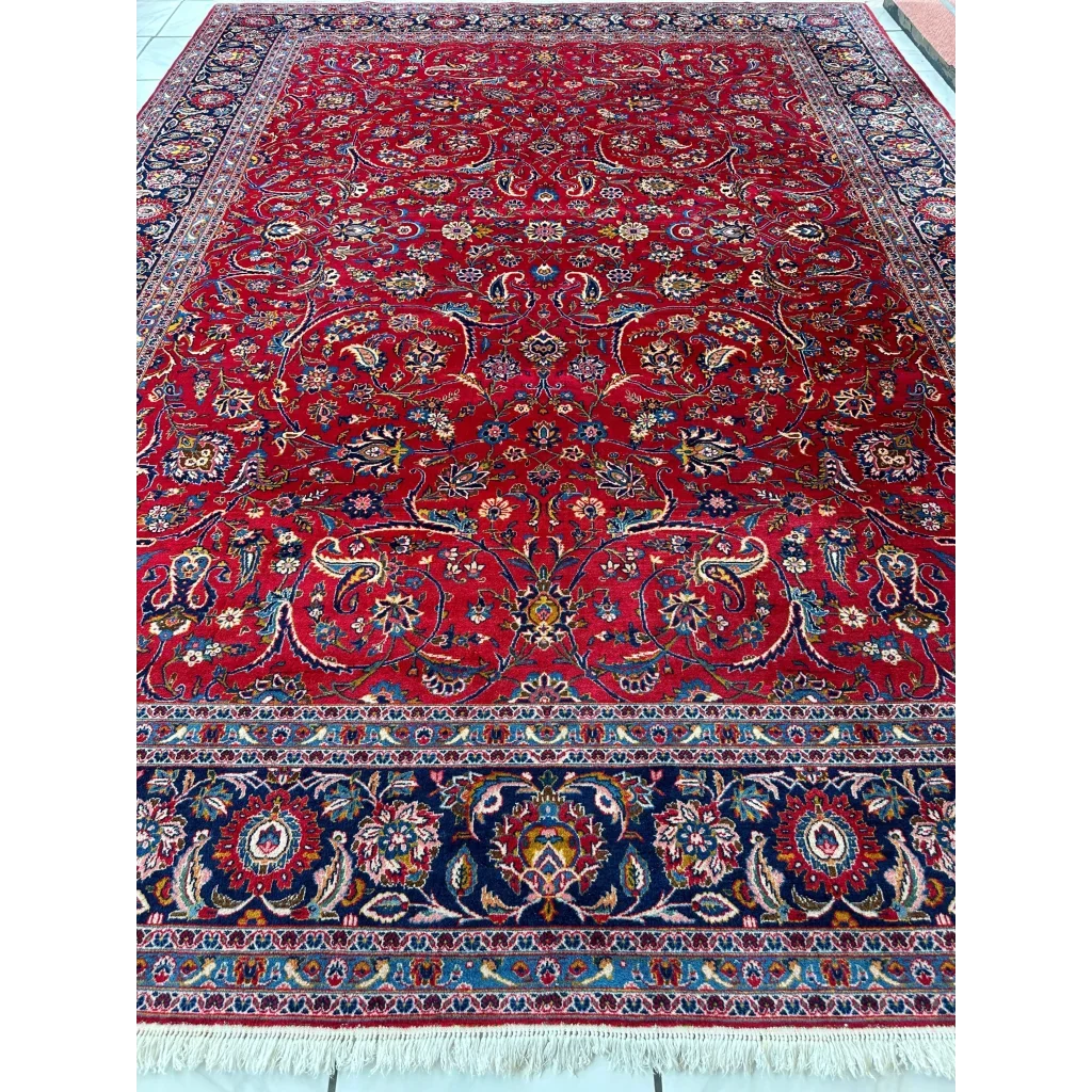 Vintage 1960s Persian red rug with intricate floral patterns, detail view