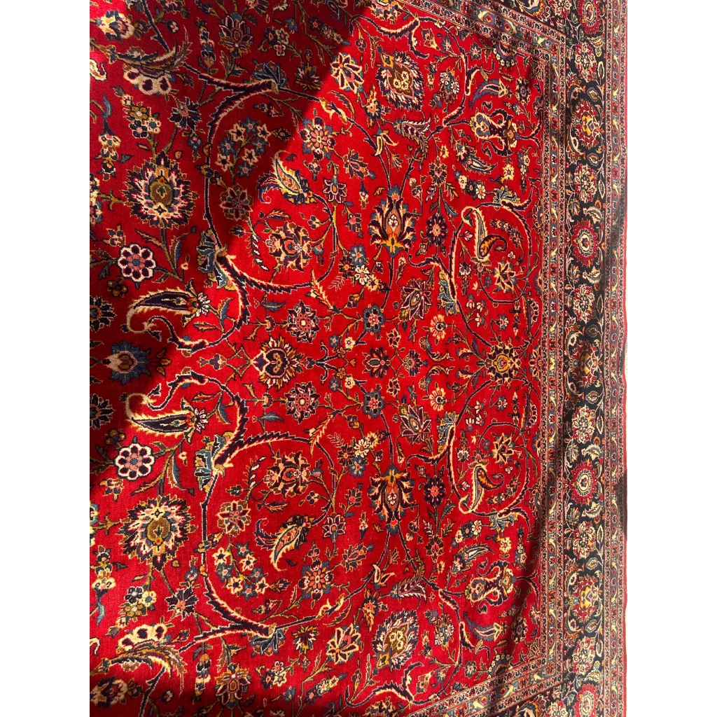 Stunning red Persian rug with intricate floral and paisley patterns