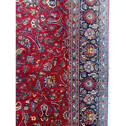 Stunning red Persian rug with intricate floral and paisley patterns
