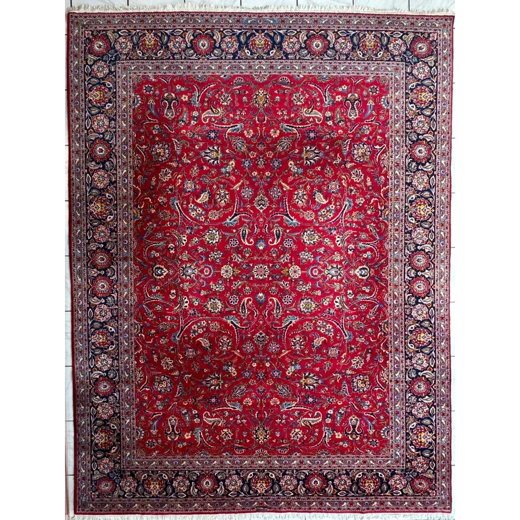 Vibrant red Persian rug with intricate floral and paisley patterns in gold, blue, and cream
