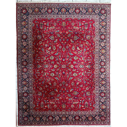 Vibrant red Persian rug with intricate floral and paisley patterns in gold, blue, and cream