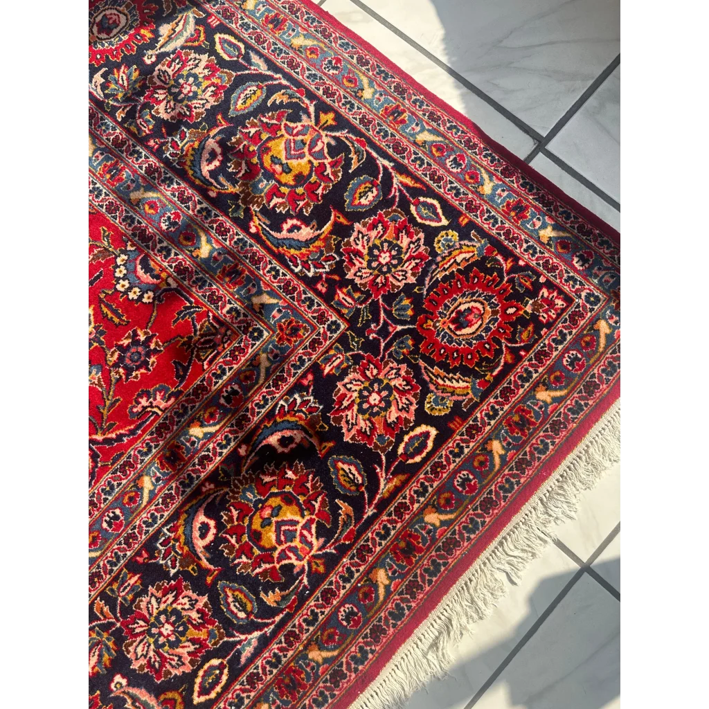 Stunning red Persian rug with intricate floral and vine patterns