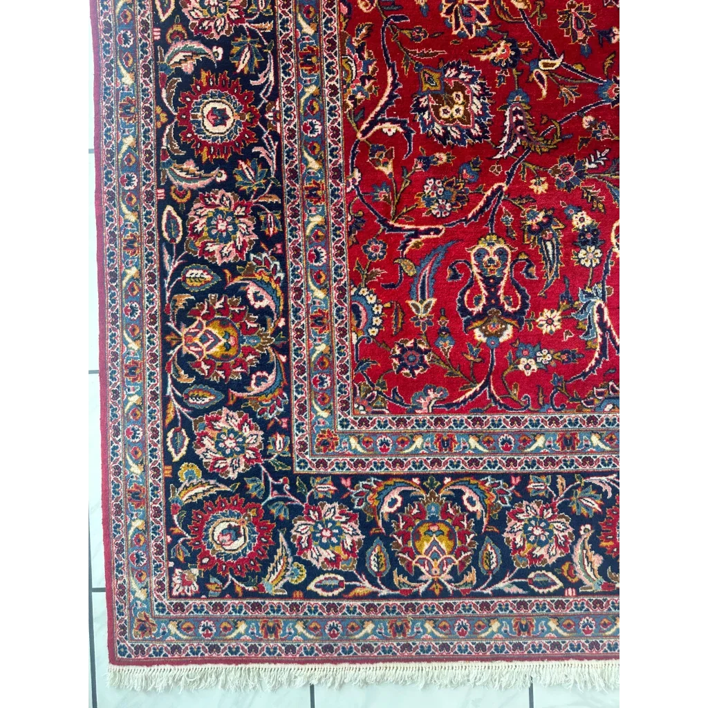 Vibrant red Persian rug with intricate floral and paisley patterns in navy, gold, and cream