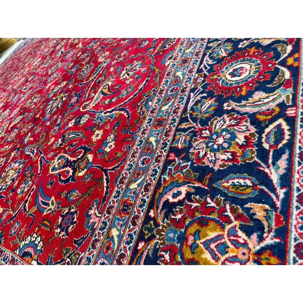 Vibrant red and blue Persian rug with intricate floral paisley patterns