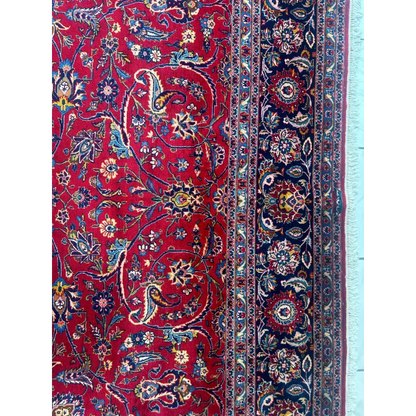 Stunning red Persian rug with intricate floral and paisley patterns