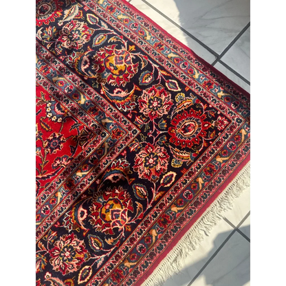 Stunning red Persian rug with intricate floral patterns