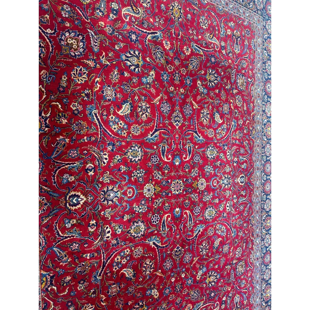Vibrant red Persian rug with intricate floral and paisley patterns