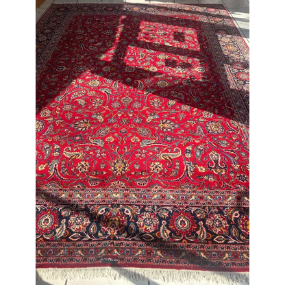 Stunning red Persian rug with intricate floral patterns in gold and blue