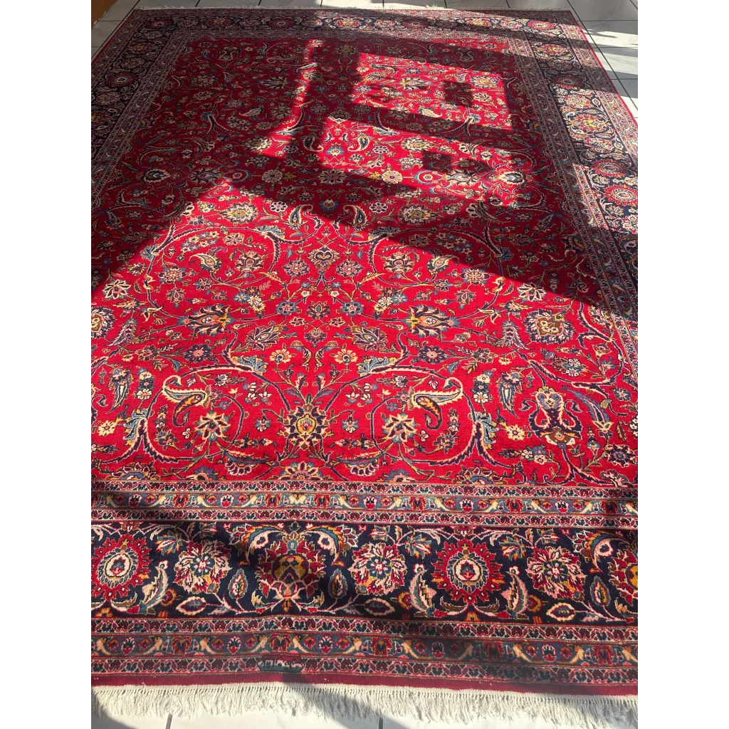 Stunning red Persian rug with intricate floral and paisley patterns