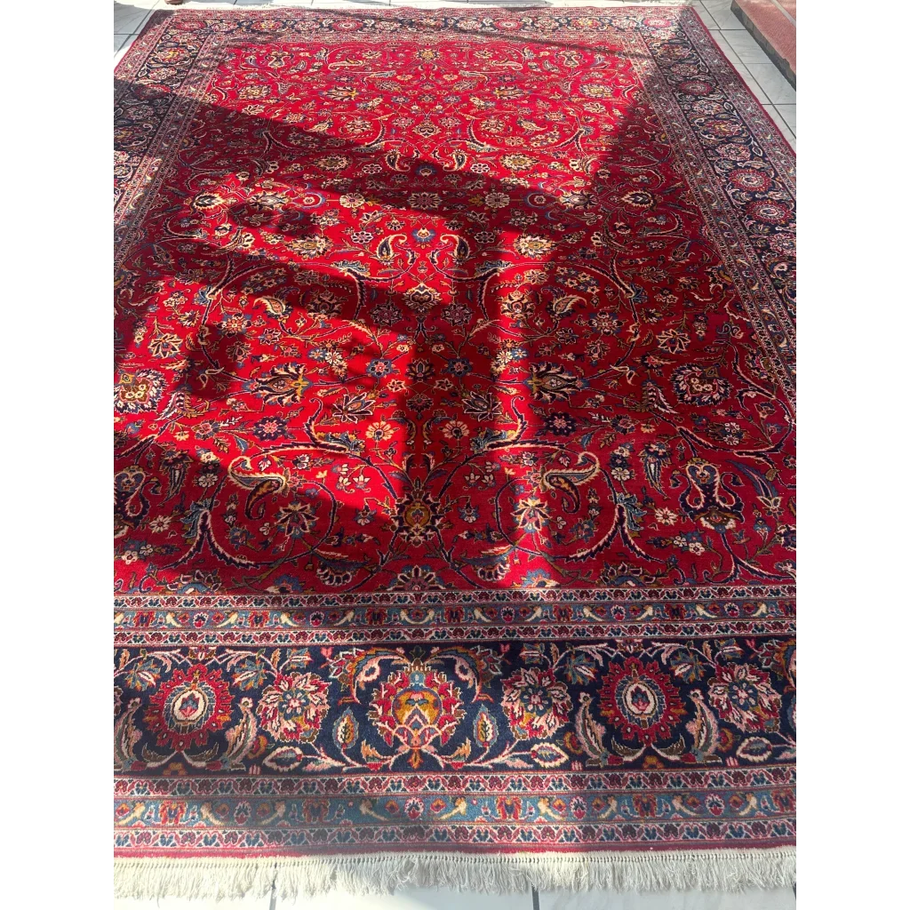 Vintage 1960s Persian red rug with intricate floral and paisley patterns in blue and cream
