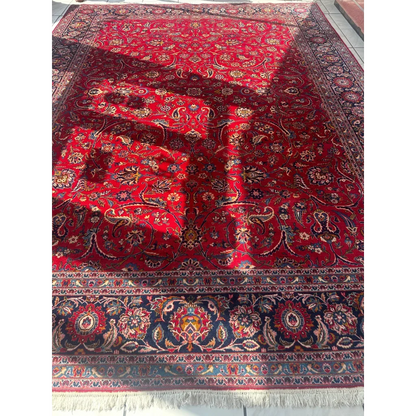 Vintage 1960s Persian red rug with intricate floral and paisley patterns in blue and cream