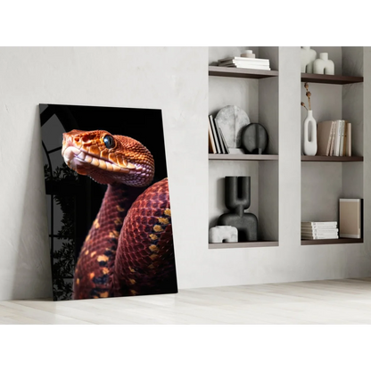 Stunning red snake glass wall art with vibrant scales on glossy black background