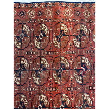 Rich red Turkmen Persian rug with geometric floral patterns