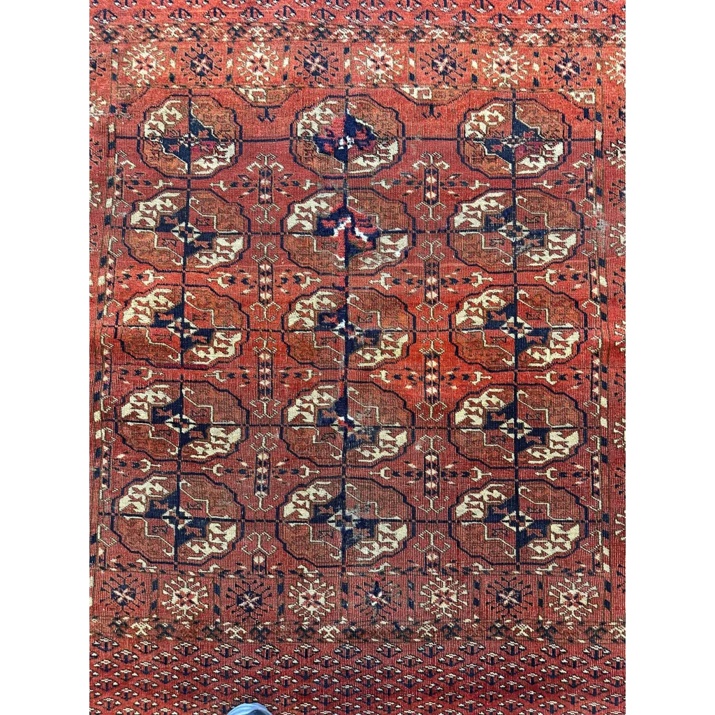 Stunning red Turkmen Persian rug with geometric floral motifs