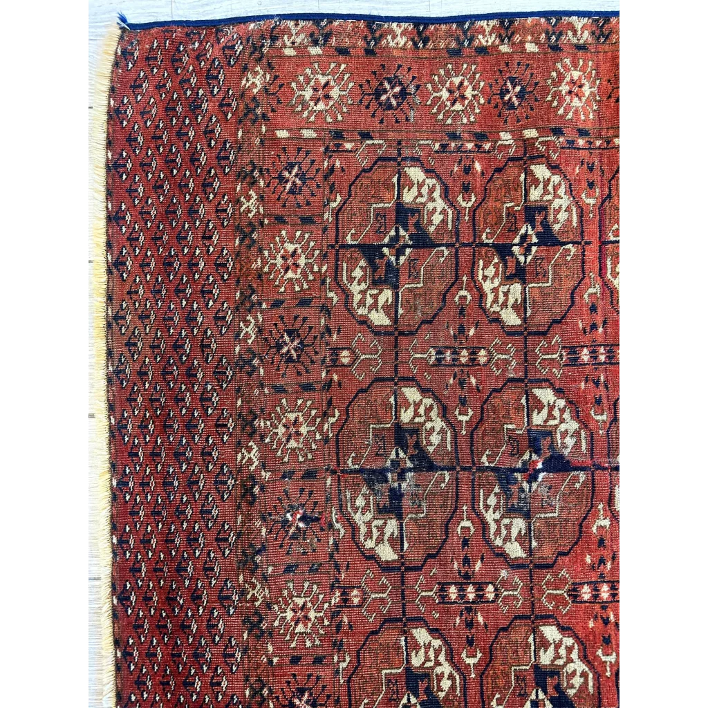 Red Turkmen Persian rug, border band detail with geometric pattern, deep red ground, Silk Road tribal art