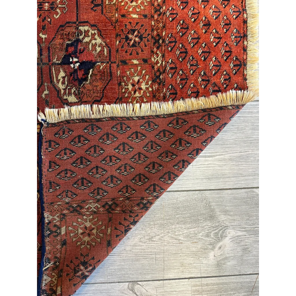 Stunning red Turkmen Persian rug with black geometric florals