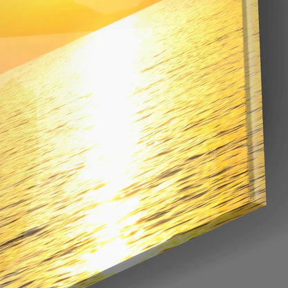 Stunning sailboat glass wall art with vibrant sunset sails and gold sconce